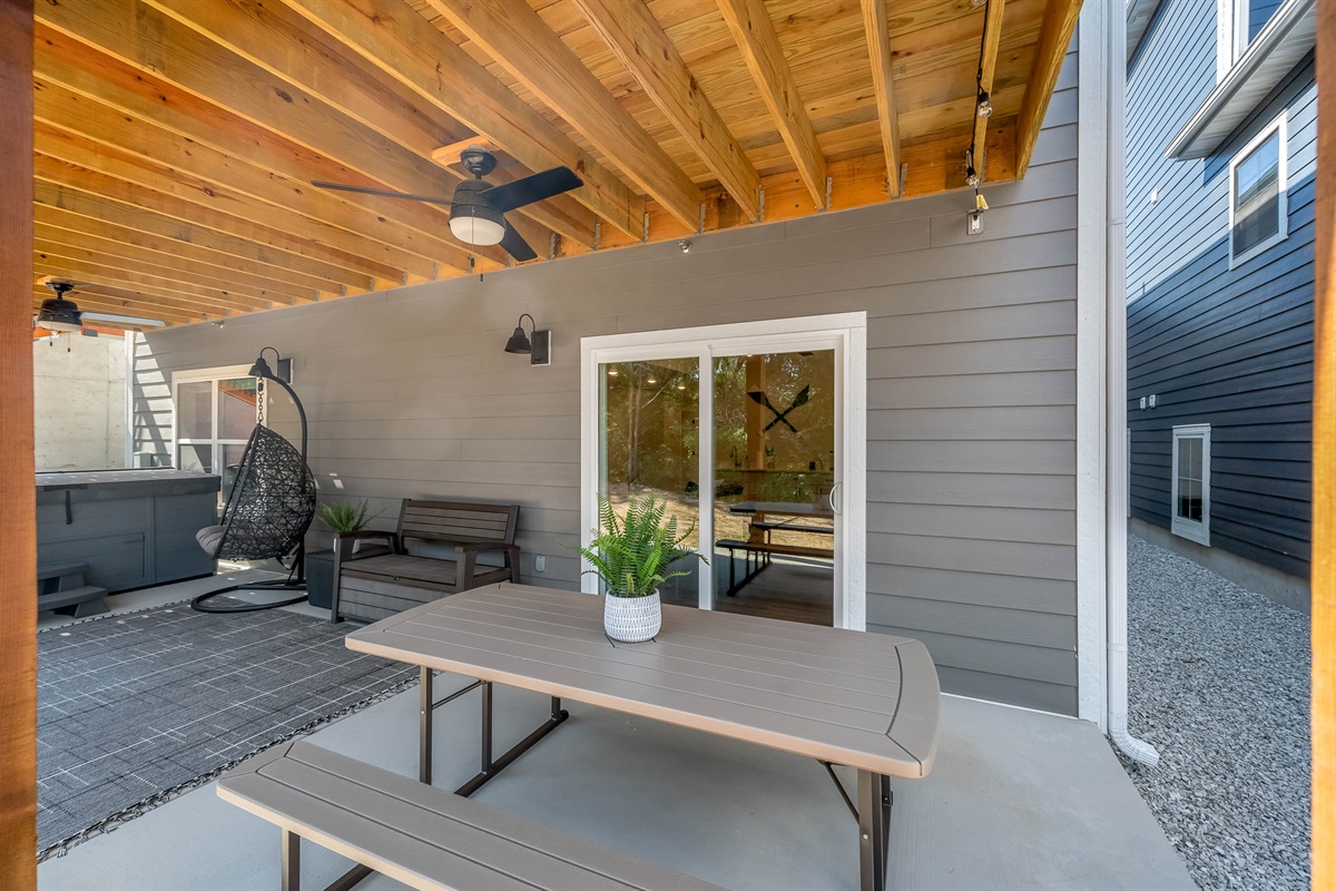 Lower level has picnic table and swinging egg chair