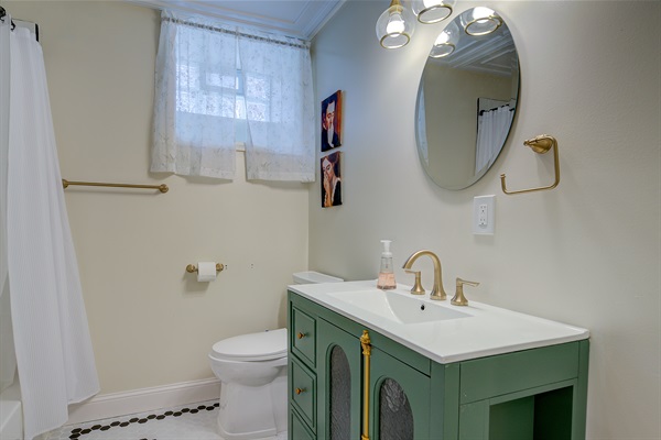 Bathroom #4 in the basement with a large soaking tub shower combo