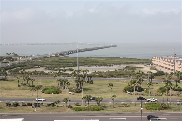 Front door opens to walkway overlooking the bay and bridge.