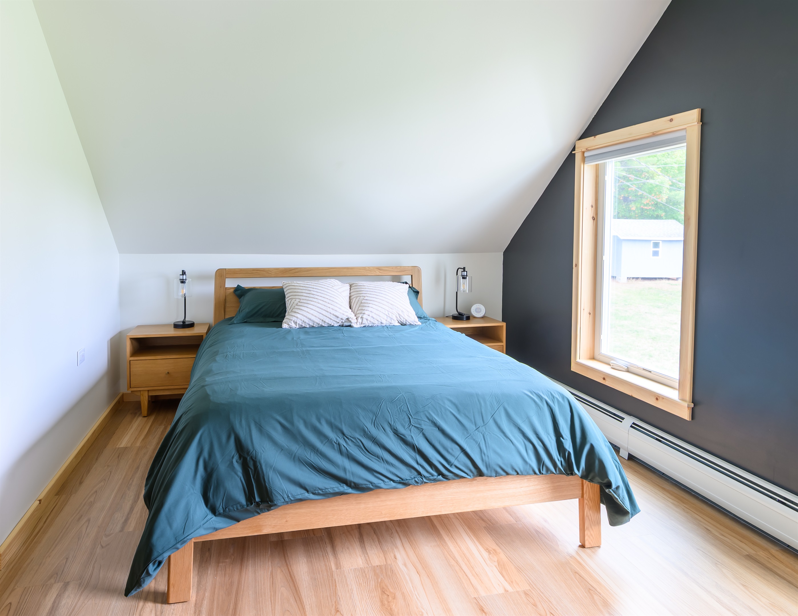 Queen bed featuring a Helix Midnight Luxe mattress for the ultimate rest