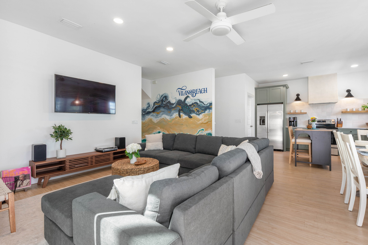 The Vilano Beach mural anchors the whole room, painted in the greens and golds of the water just down the road. Kids find the sea turtle in it first, then spend all week spotting the things they had missed.