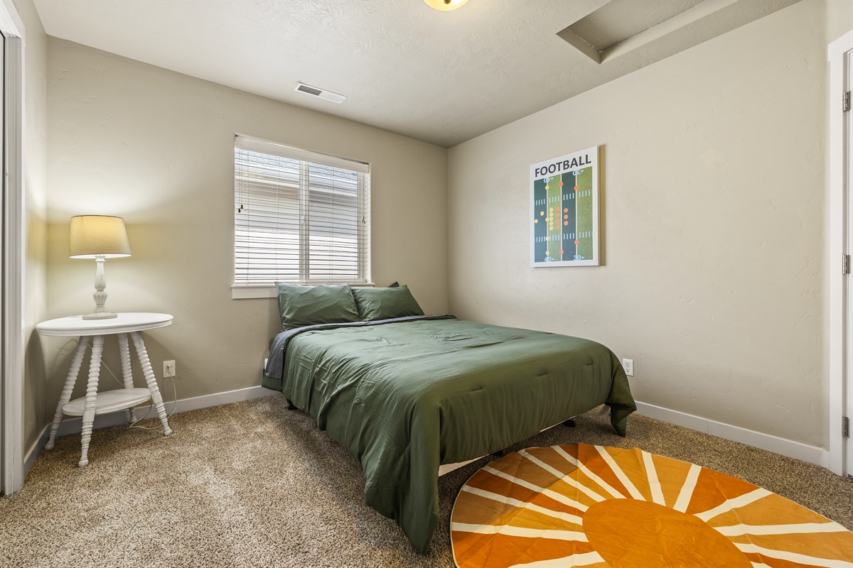 Get well deserved shut eye in this bedroom with a queen bed!