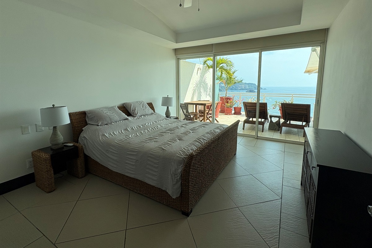 2nd Bedroom with Queen sized bed and side tables.