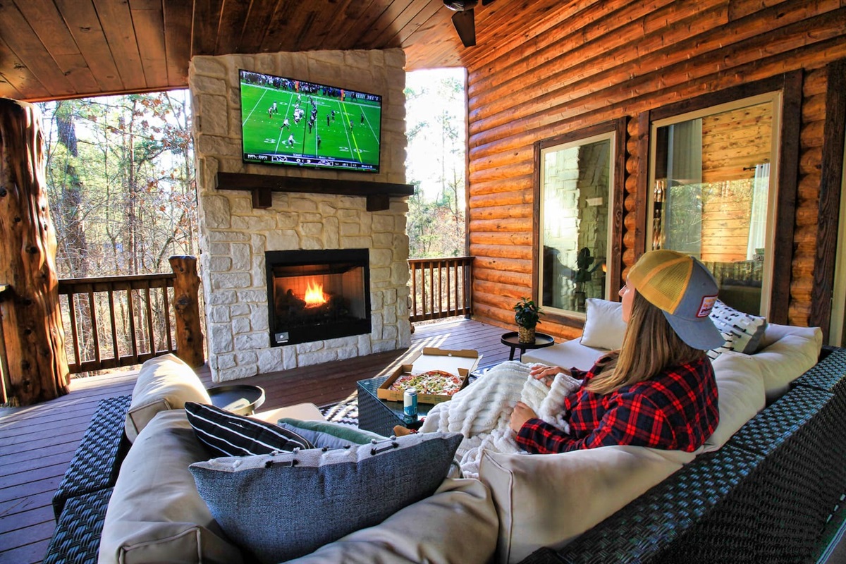 Outdoor living space with smart TV and cozy seating—perfect for family movie nights or catching the game under the stars.
