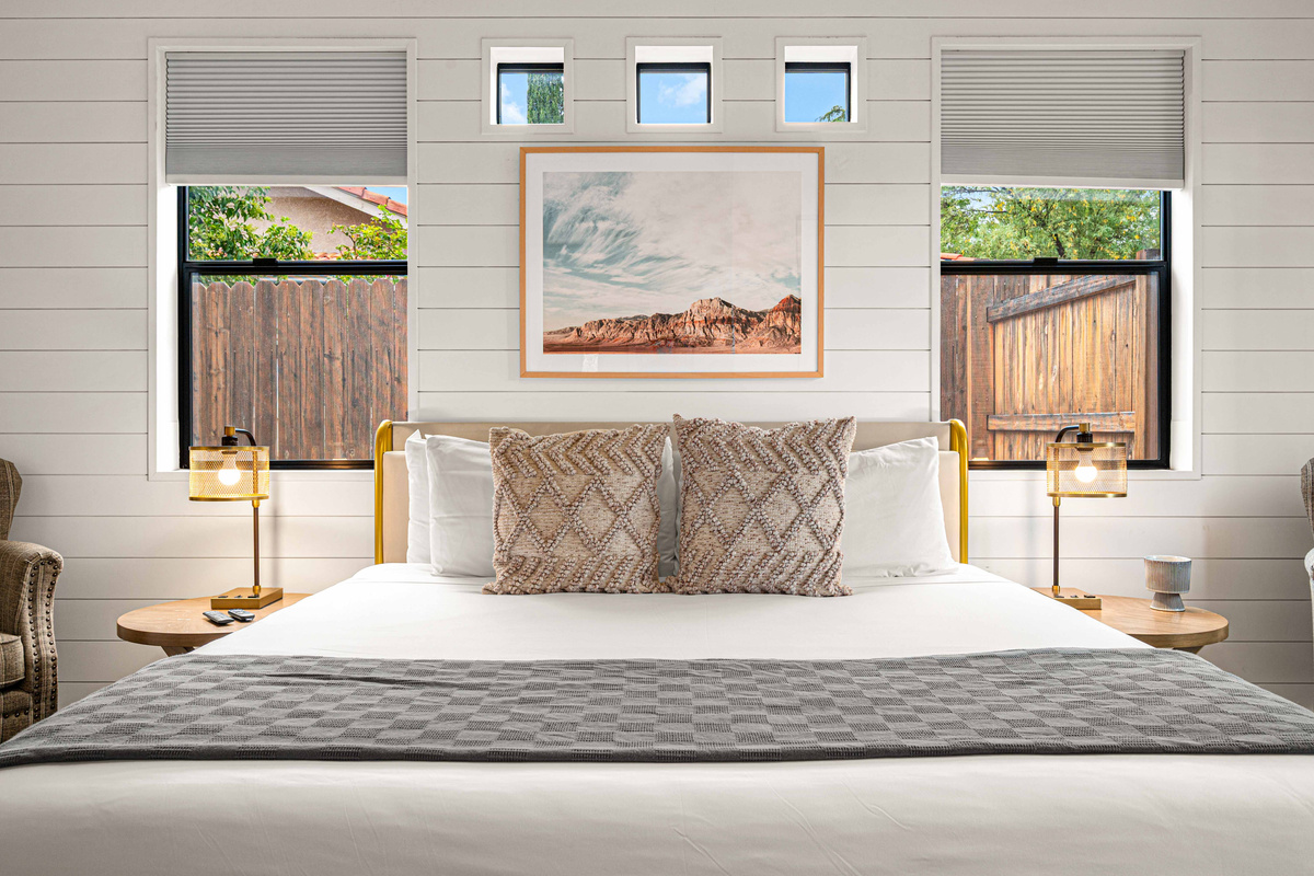 {Bedroom 1} Sink into a plush king bed with crisp linens and calming desert-inspired design.