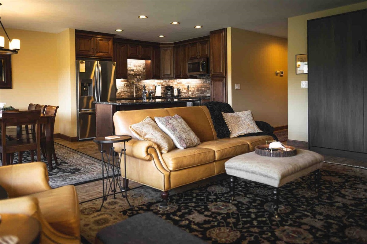 Living room with a view of the dining room and kitchen