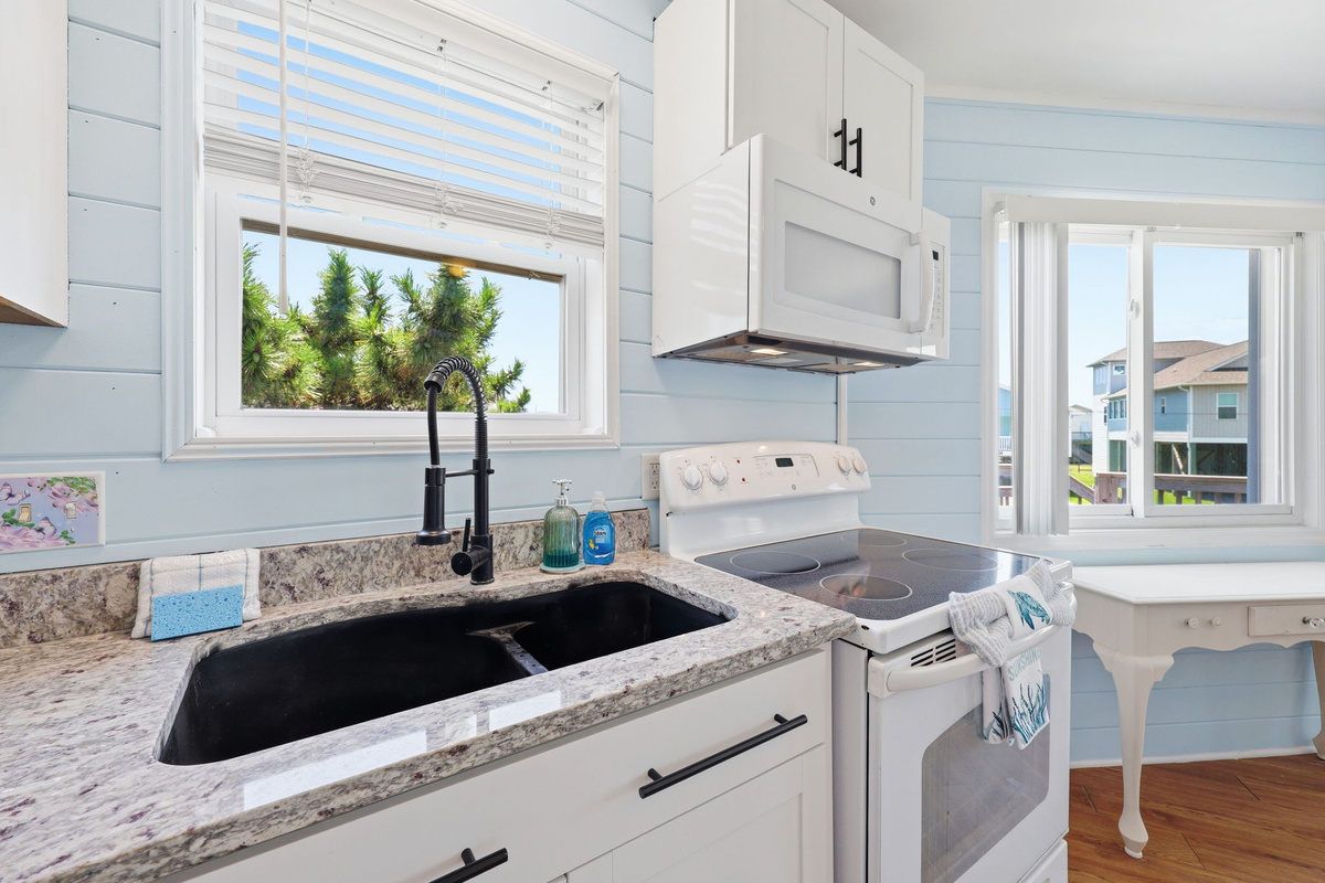 Modern kitchen with updated appliances and natural light