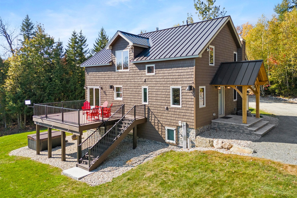 Back of house with deck