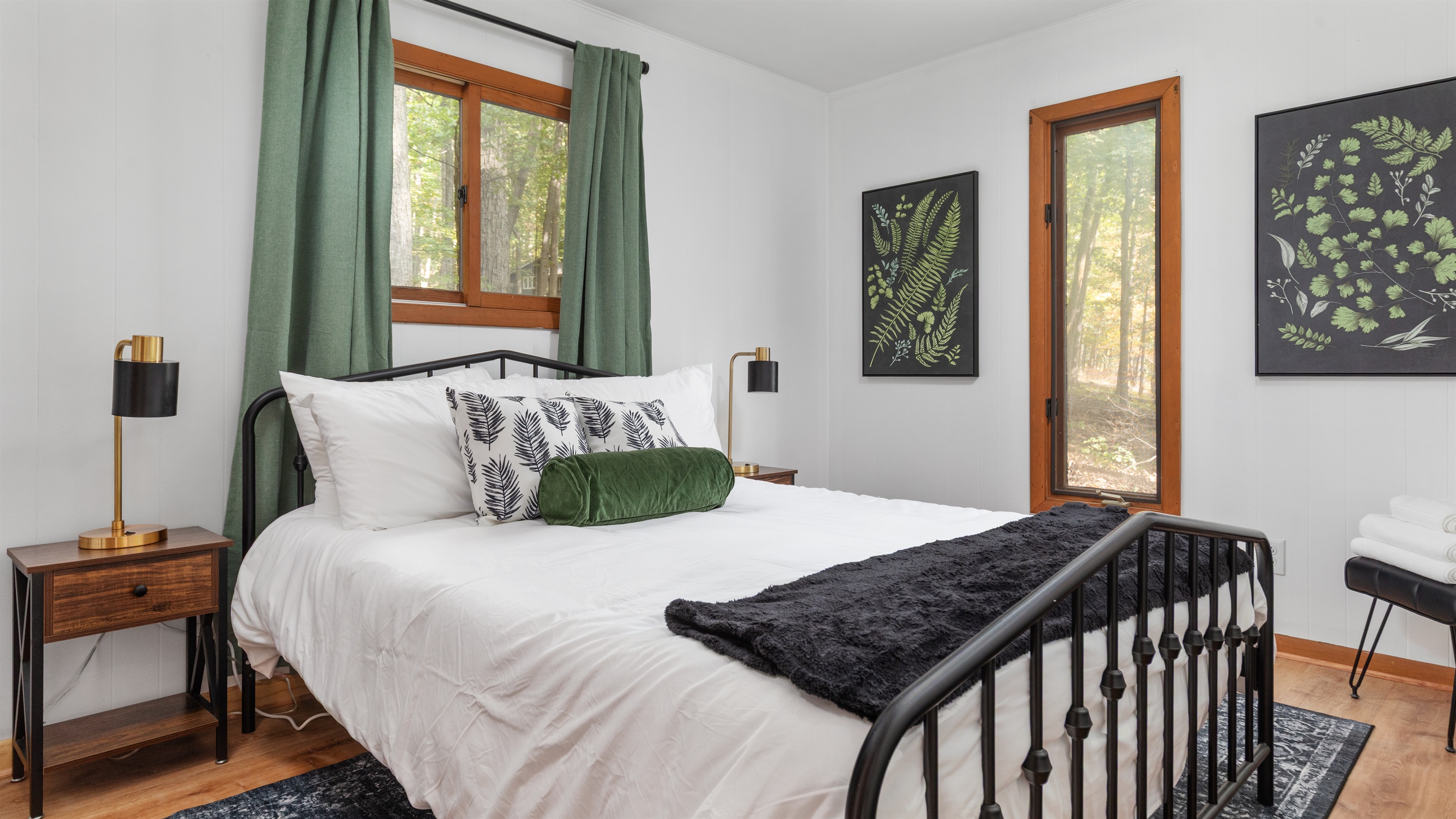 Unwind in this serene Queen bedroom with its own half bath—perfect for a peaceful night's rest.