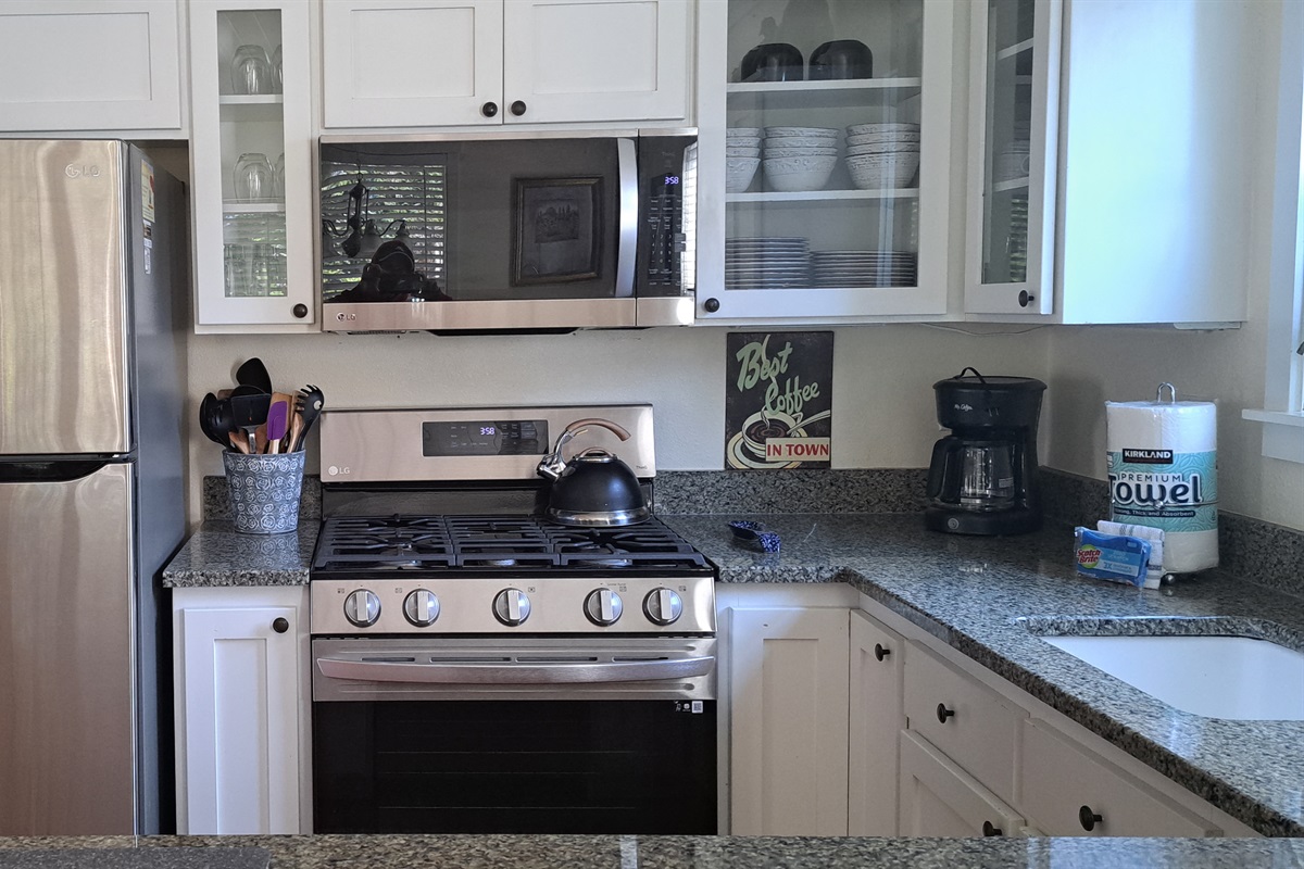 Prepare meals with ease using the modern stainless-steel appliances in the kitchen.