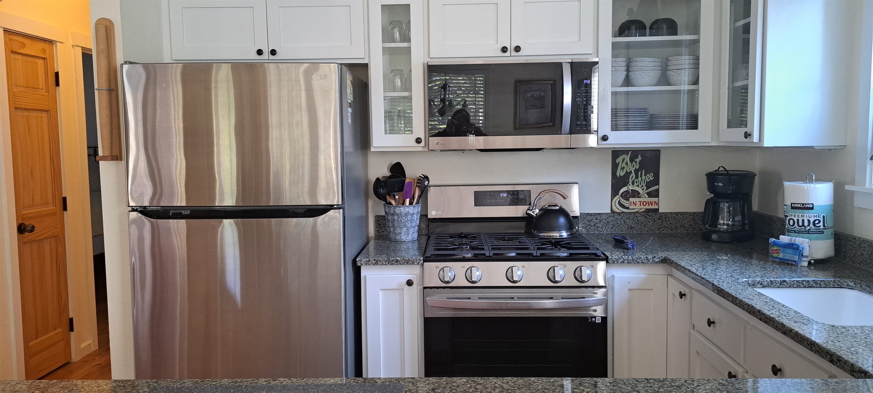 Prepare meals with ease using the modern stainless-steel appliances in the kitchen.
