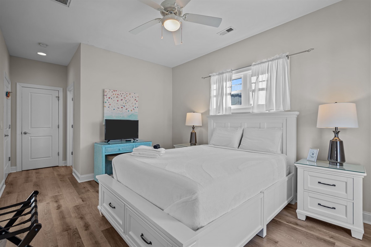 3rd floor queen bedroom #6 with smart TV, balcony access and intracoastal waterway views