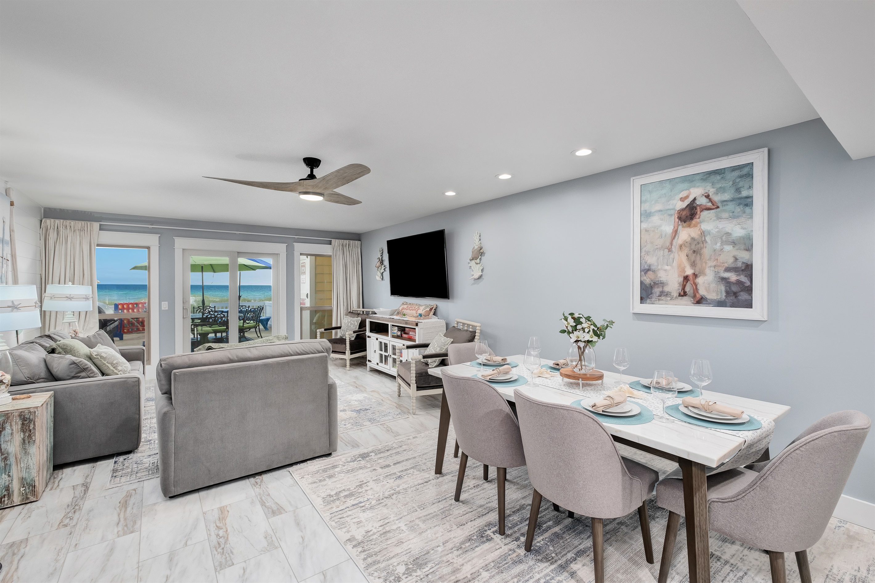 Enjoy an open-concept living and dining area with stunning ocean views. Perfect for family gatherings and entertaining.