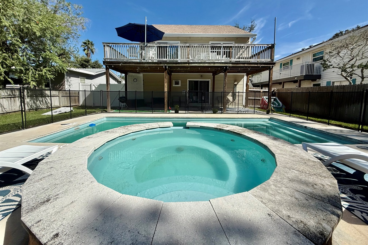 Relax in the elevated spa while overlooking the pool and backyard.