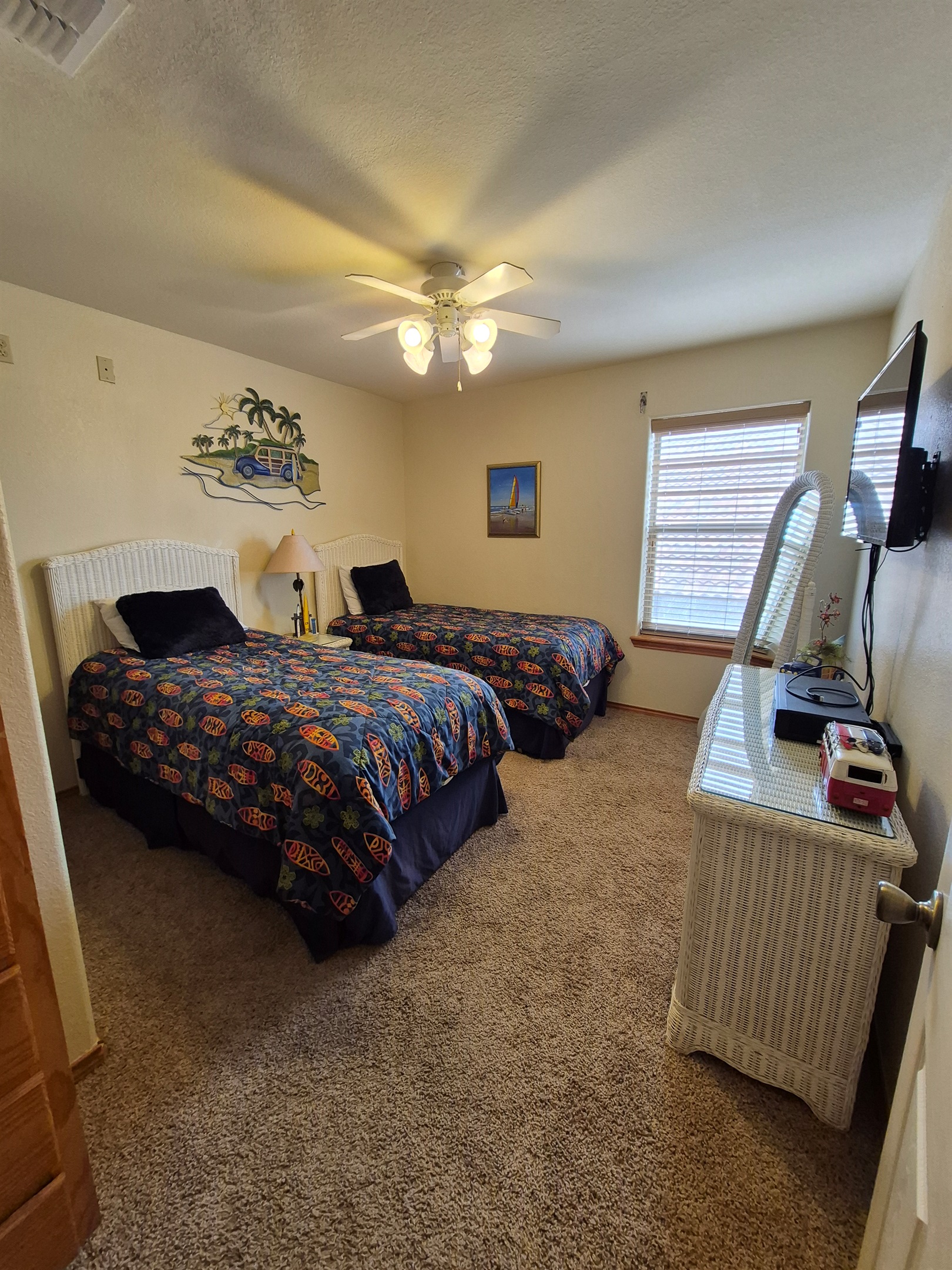 Enjoy the surfing vibes in this 3rd level double twin guest bedroom. (TV, VCR/DVD player, HDMI connectivity)