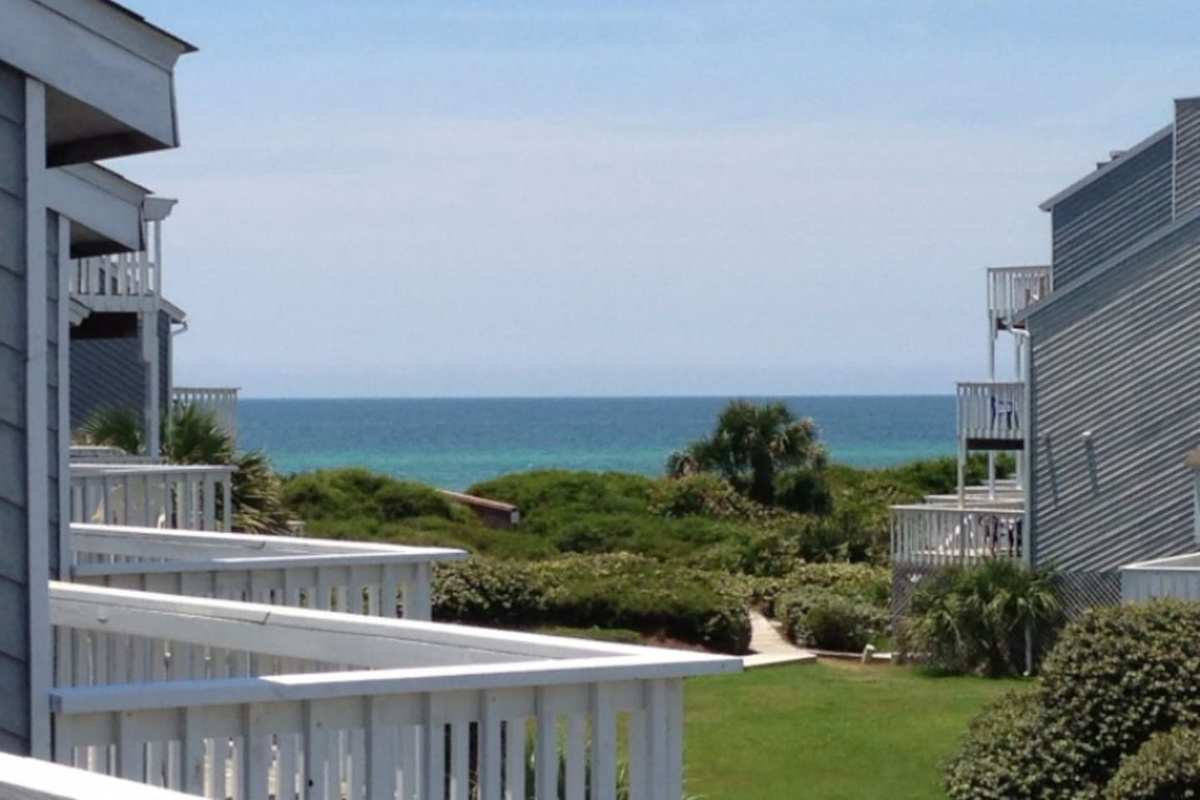 Step out the back door and this is what waits for you &mdash; Gulf water stretching to the horizon, 90 steps from your feet to the sand.