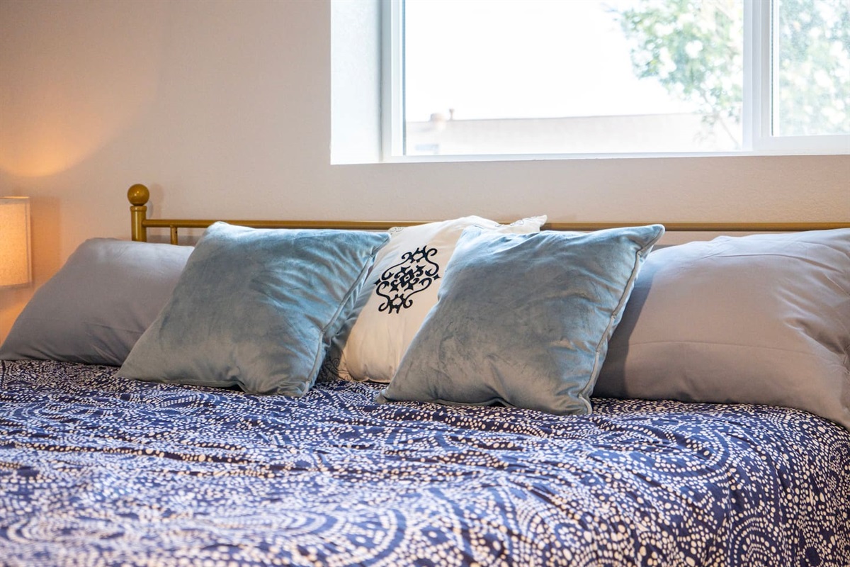 Sink into plush bedding and unwind in this serene bedroom retreat—soft textures, calming tones, and the perfect space to recharge after a day in Scottsdale