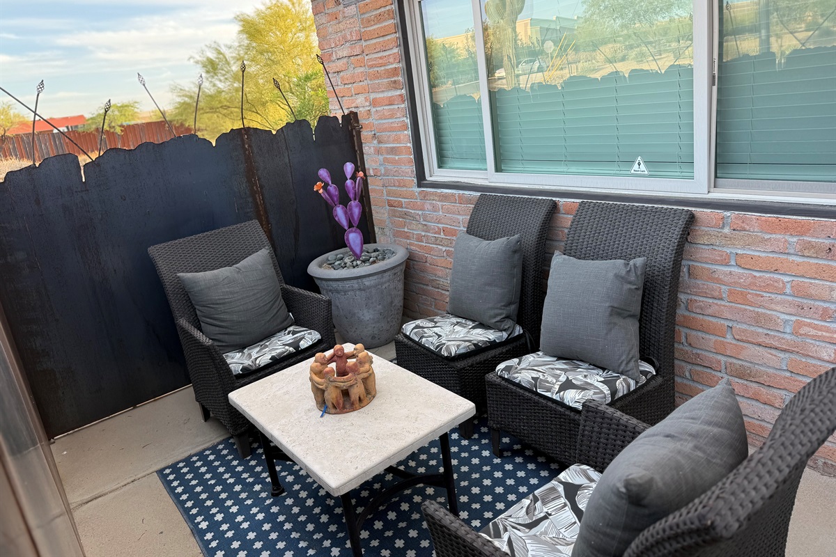 Private outdoor sitting area in courtyard.
