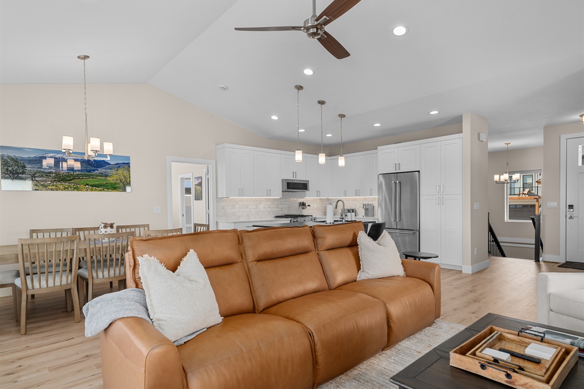 Spacious open-concept living connecting kitchen, dining, and lounge—ideal for group stays.