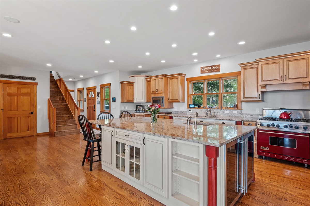 Fully stocked kitchen with massive island, viking range, sub zero fridge, dual beverage centers, and every you could need to cook like a chef and host all your guests
