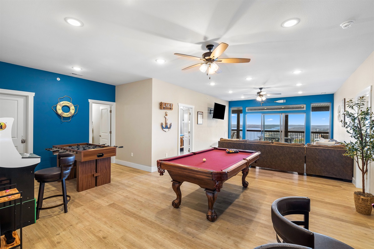 Game room featuring a pool table and cozy seating—perfect for entertaining and relaxation!