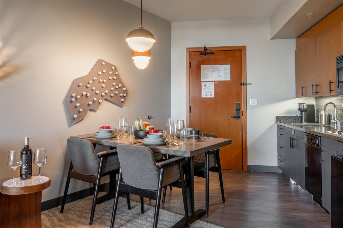 The dining area seats four and is seamlessly integrated into the kitchen, making meals and conversation easy and relaxed.