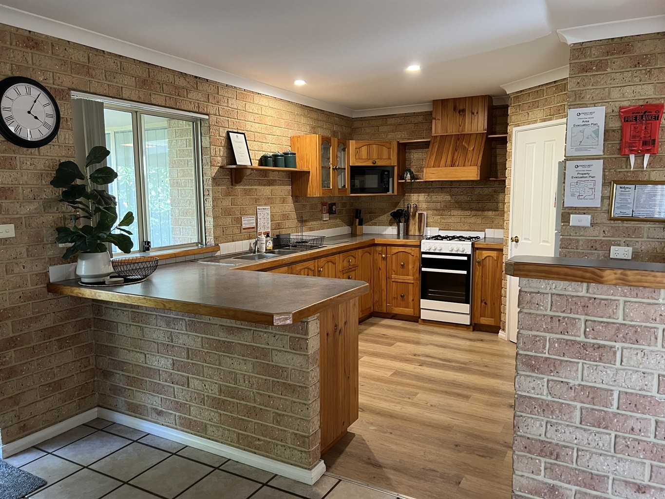 Large Country style kitchen with full size fridge and gas cooking