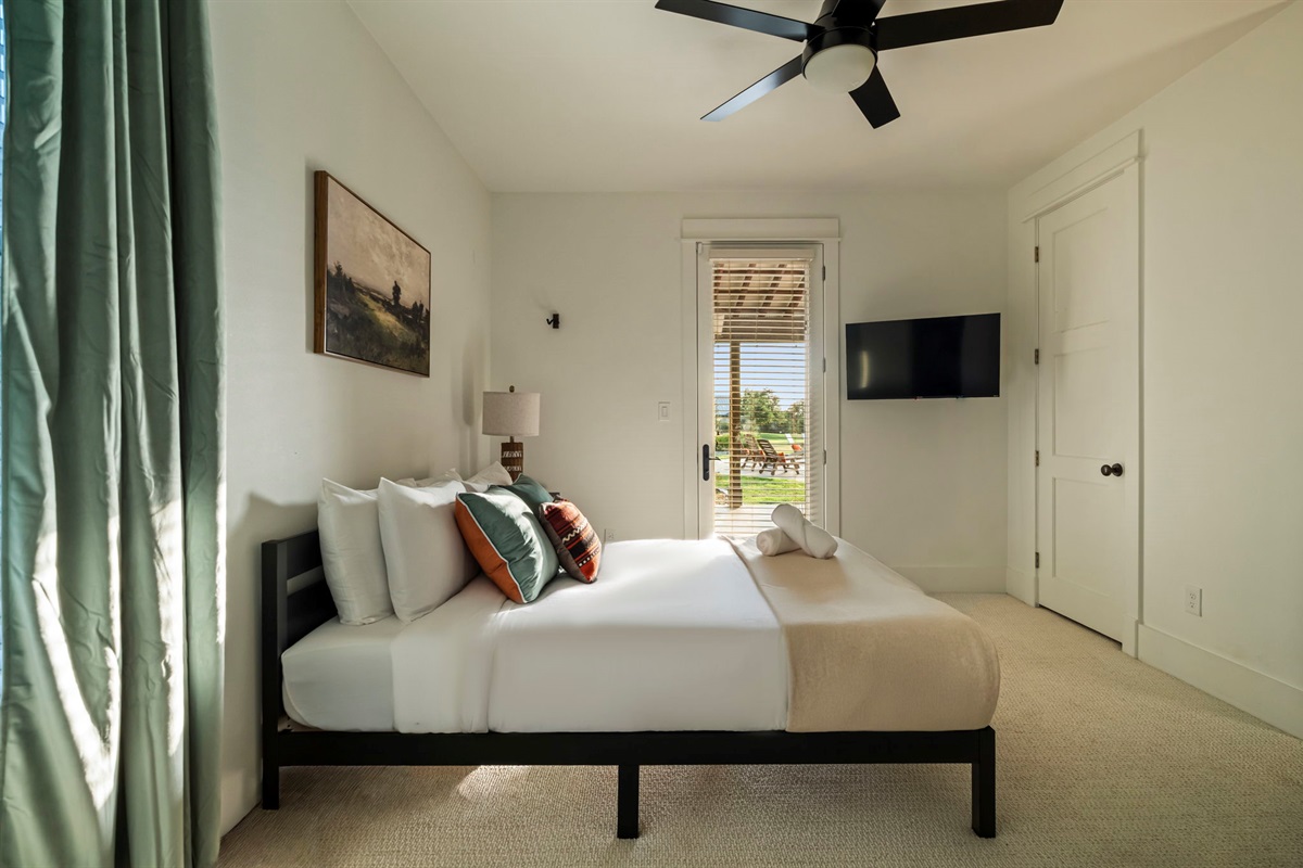 Includes a TV, ceiling fan, and bedside lamp for comfort and convenience.