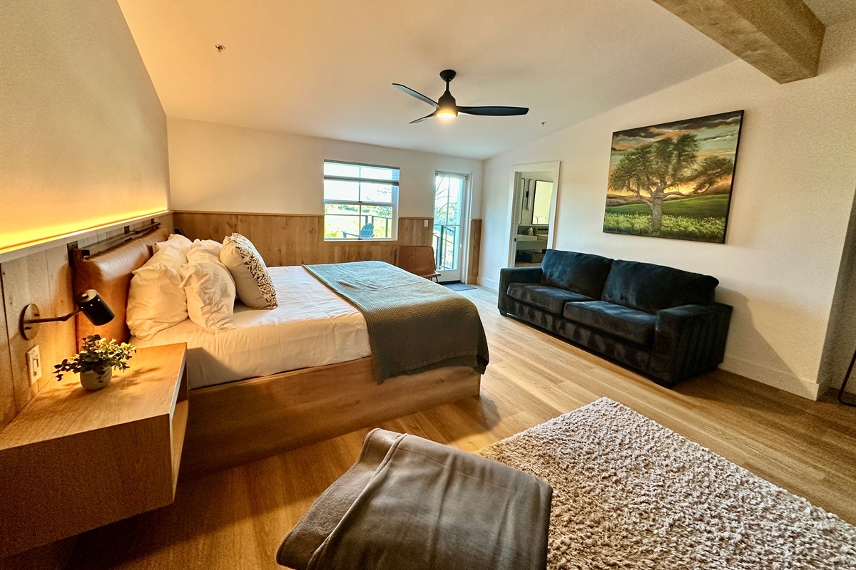 An elevated king-sized haven offering a plush, puffy mattress and a private lounge area for ultimate relaxation.