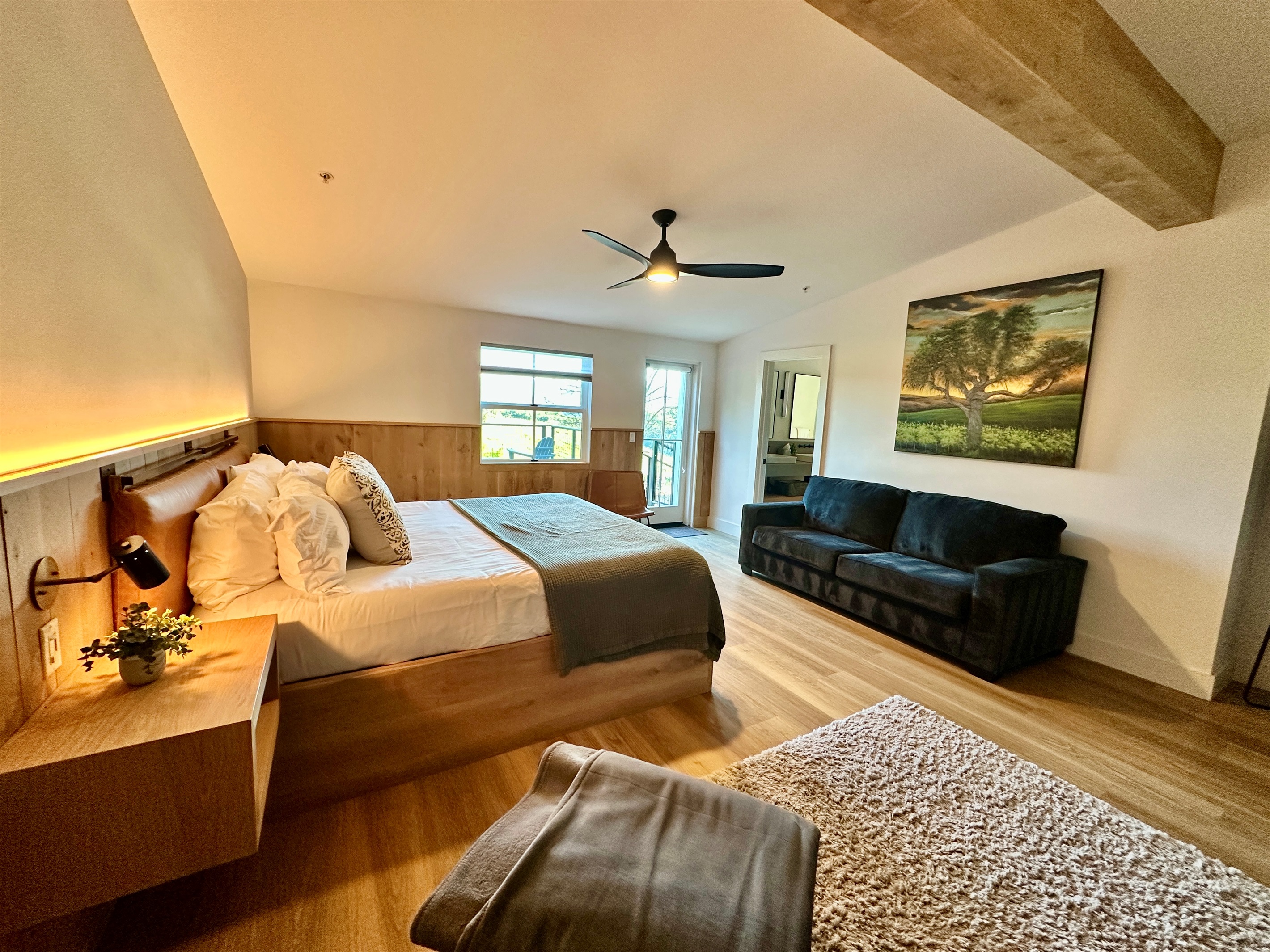 An elevated king-sized haven offering a plush, puffy mattress and a private lounge area for ultimate relaxation.