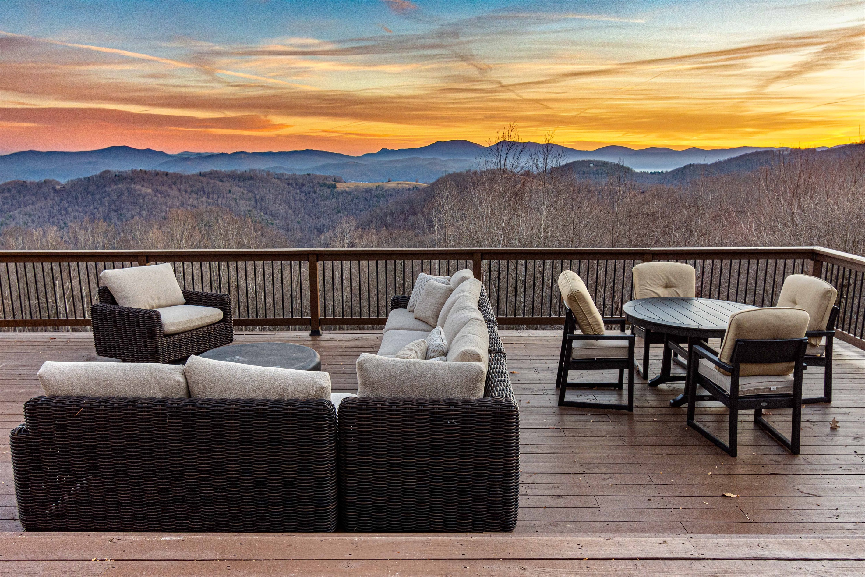 Outdoor lounge and dining areas on the expansive deck are perfectly positioned for sunset views and easy gathering.