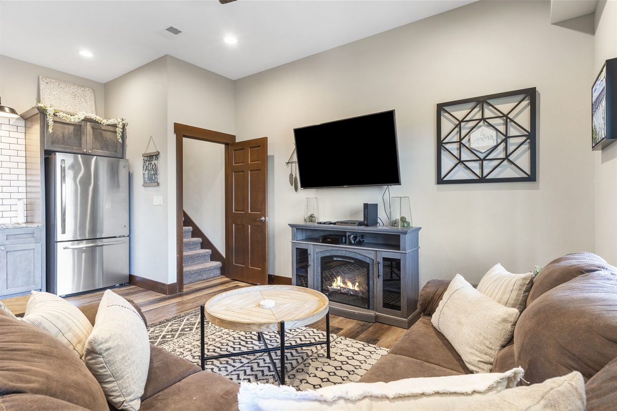 Lower level seating with electric fireplace