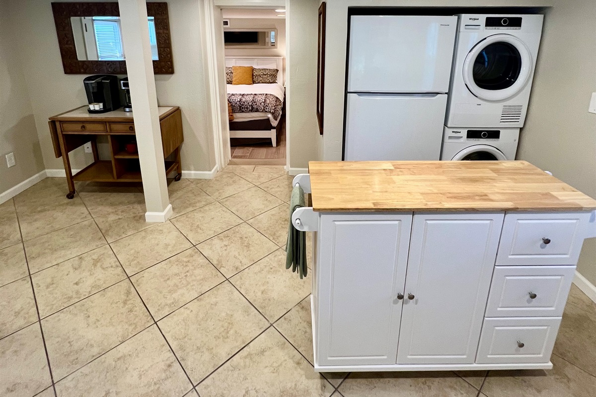 All the comforts of home, including your own in-suite laundry, a full kitchen with a prep island, and a cozy bedroom retreat