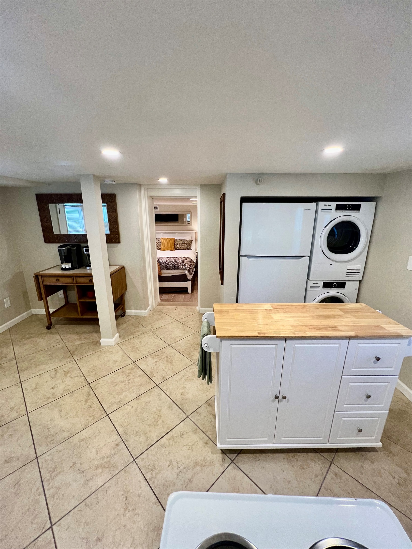 All the comforts of home, including your own in-suite laundry, a full kitchen with a prep island, and a cozy bedroom retreat