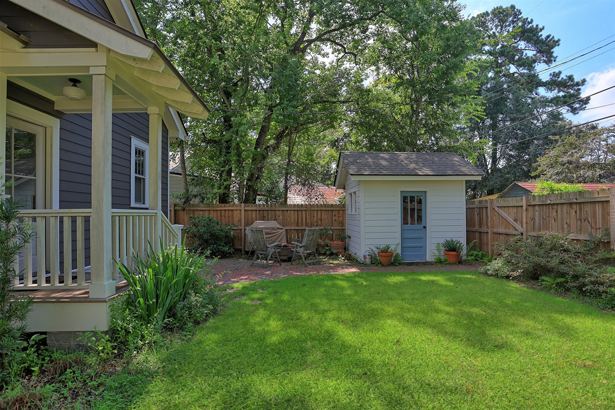 The spacious backyard offers plenty of room for games, gardening, or just soaking up the sunshine.
