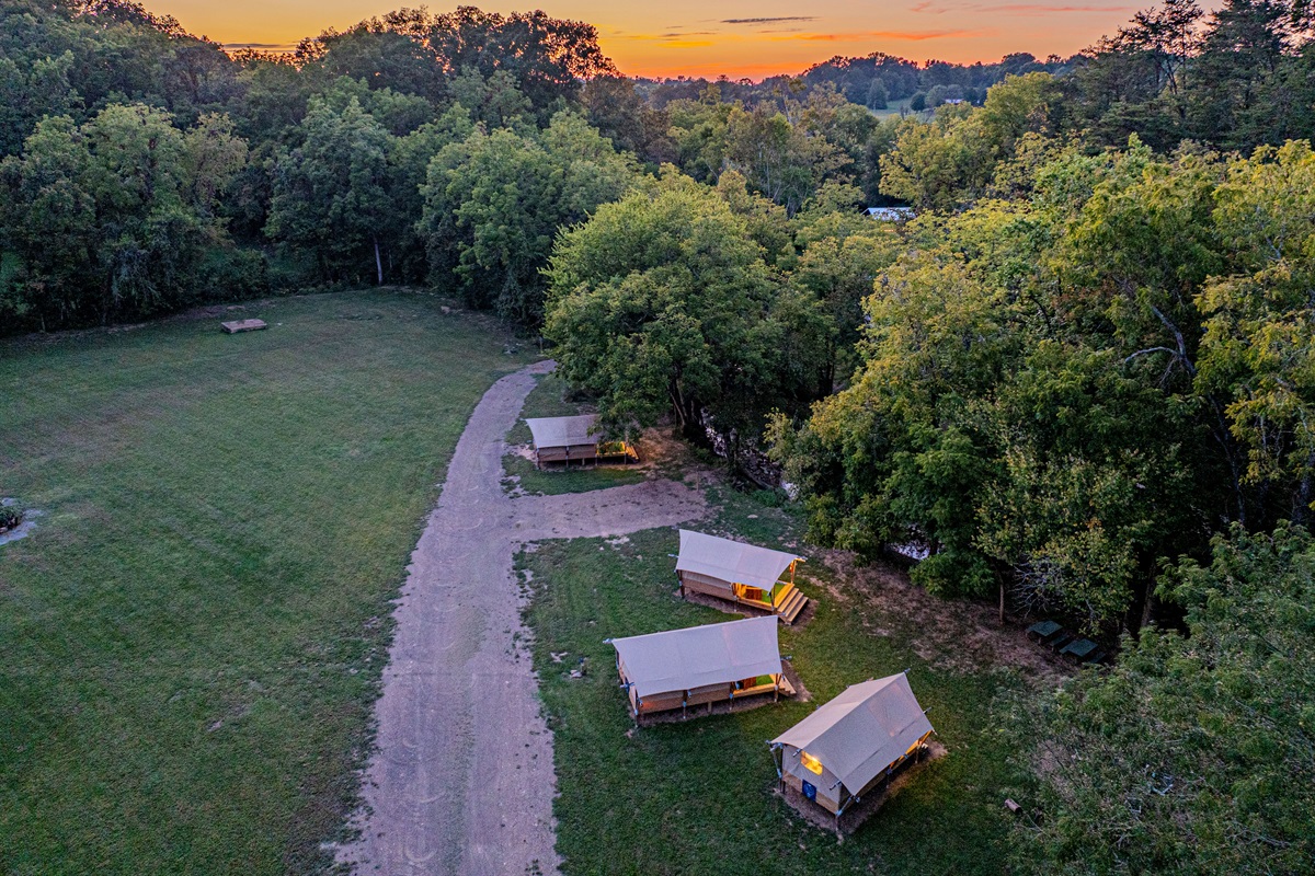 Golden hour at your Smoky Mountain escape. As the sun sets over the trees, the site comes alive. Settle into your cozy tent for a peaceful night under the wide-open sky.