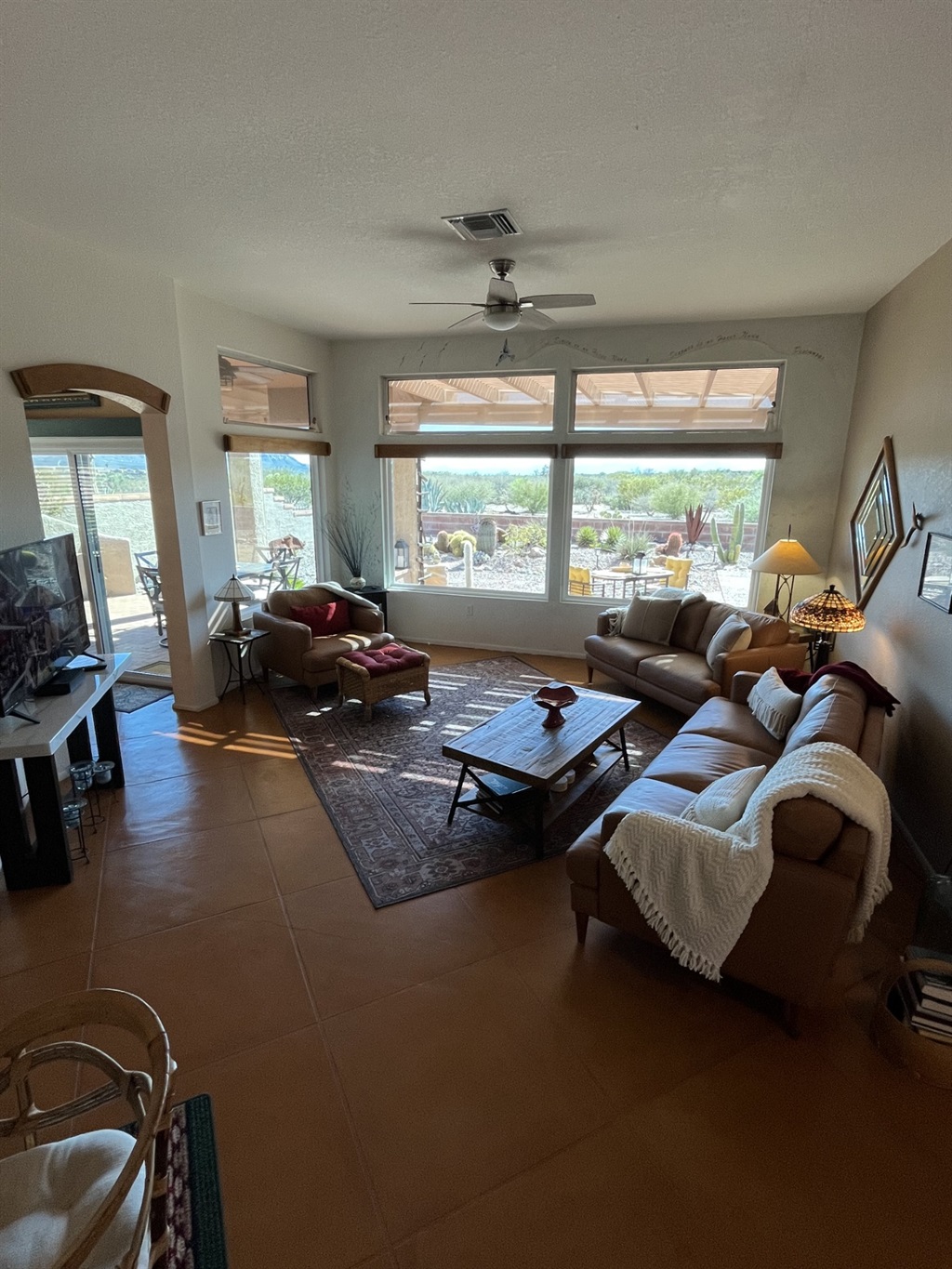 Spacious, bright and sunny living room area with mountain views.