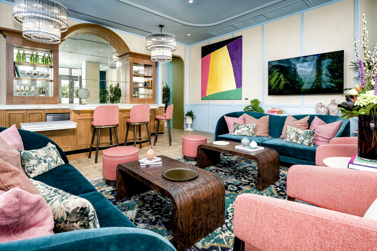A media and social lounge with plush seating and contemporary art - the building's after-dark living room.
