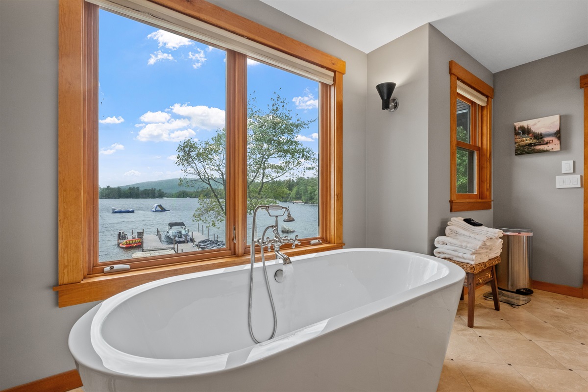 Second floor master bathroom with Lake Winnipesaukee views soaking, tub and walk in shower
