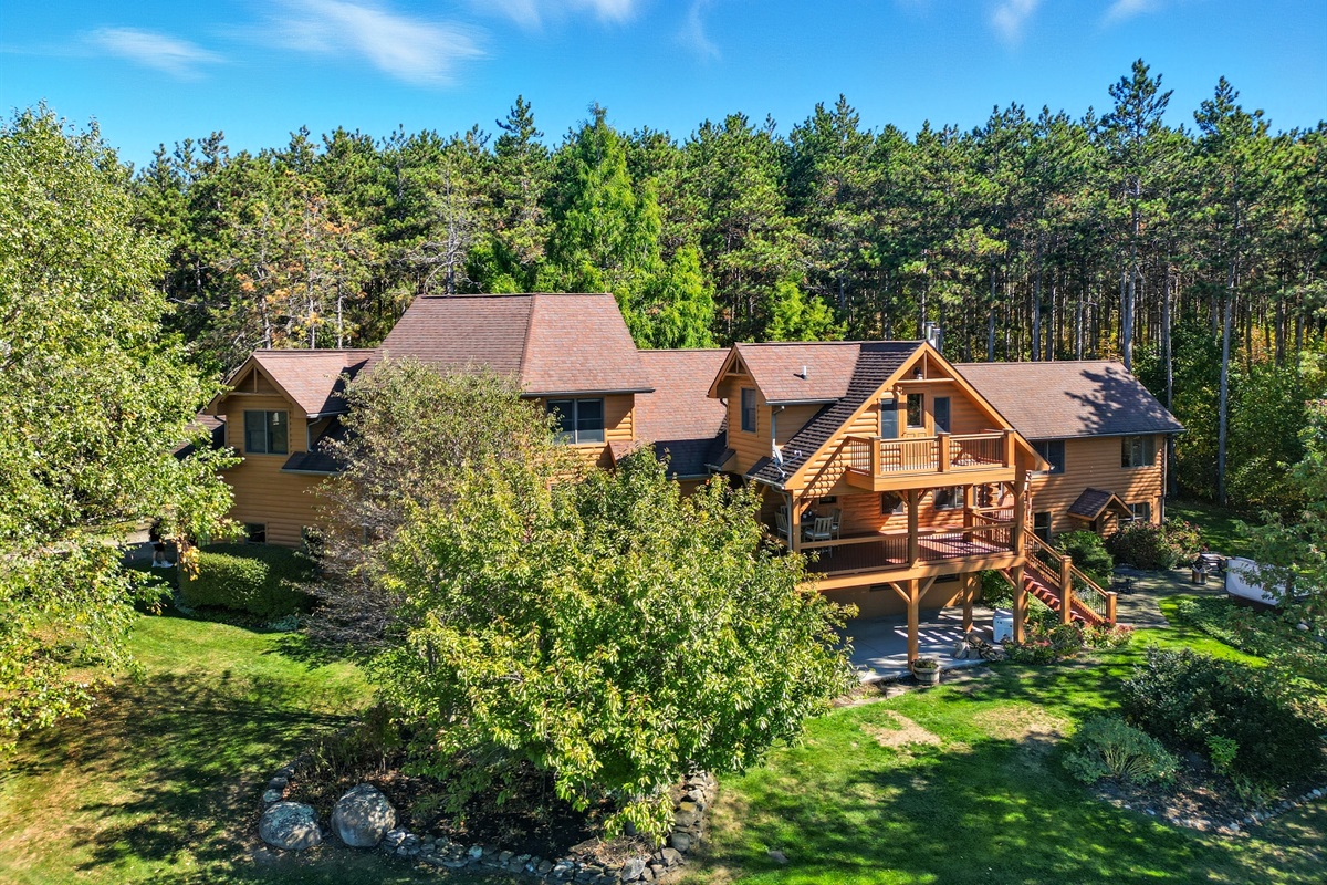 Stunning lodge-style home nestled in the woods, offering rustic charm with modern luxury for the ultimate getaway.
