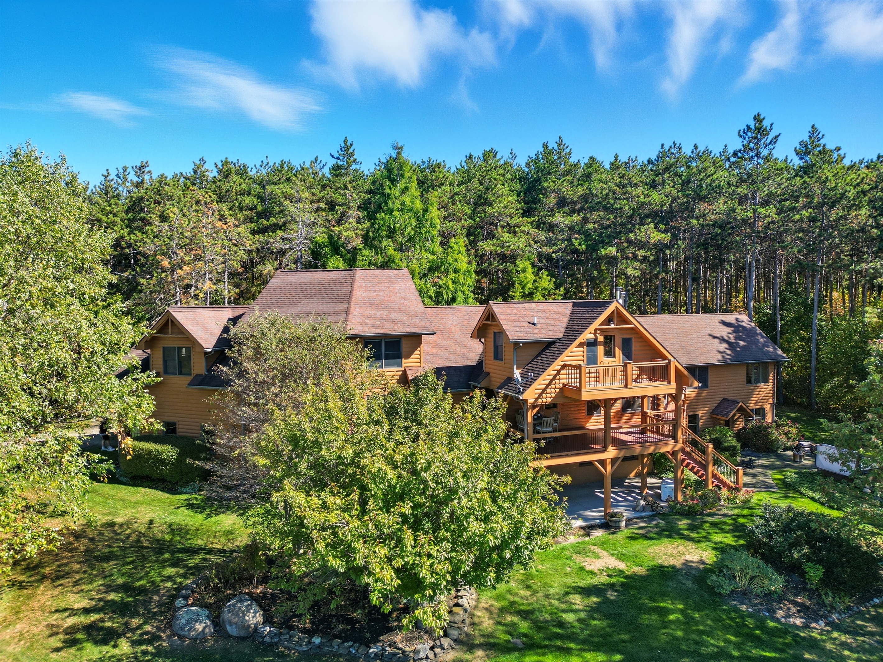 Stunning lodge-style home nestled in the woods, offering rustic charm with modern luxury for the ultimate getaway.