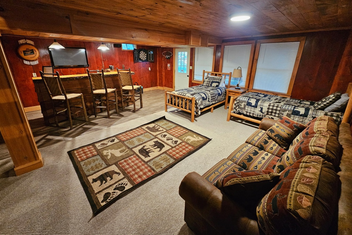 Twin beds, a sofa bed, television, darts, and games are available in the walk-out finished basement.