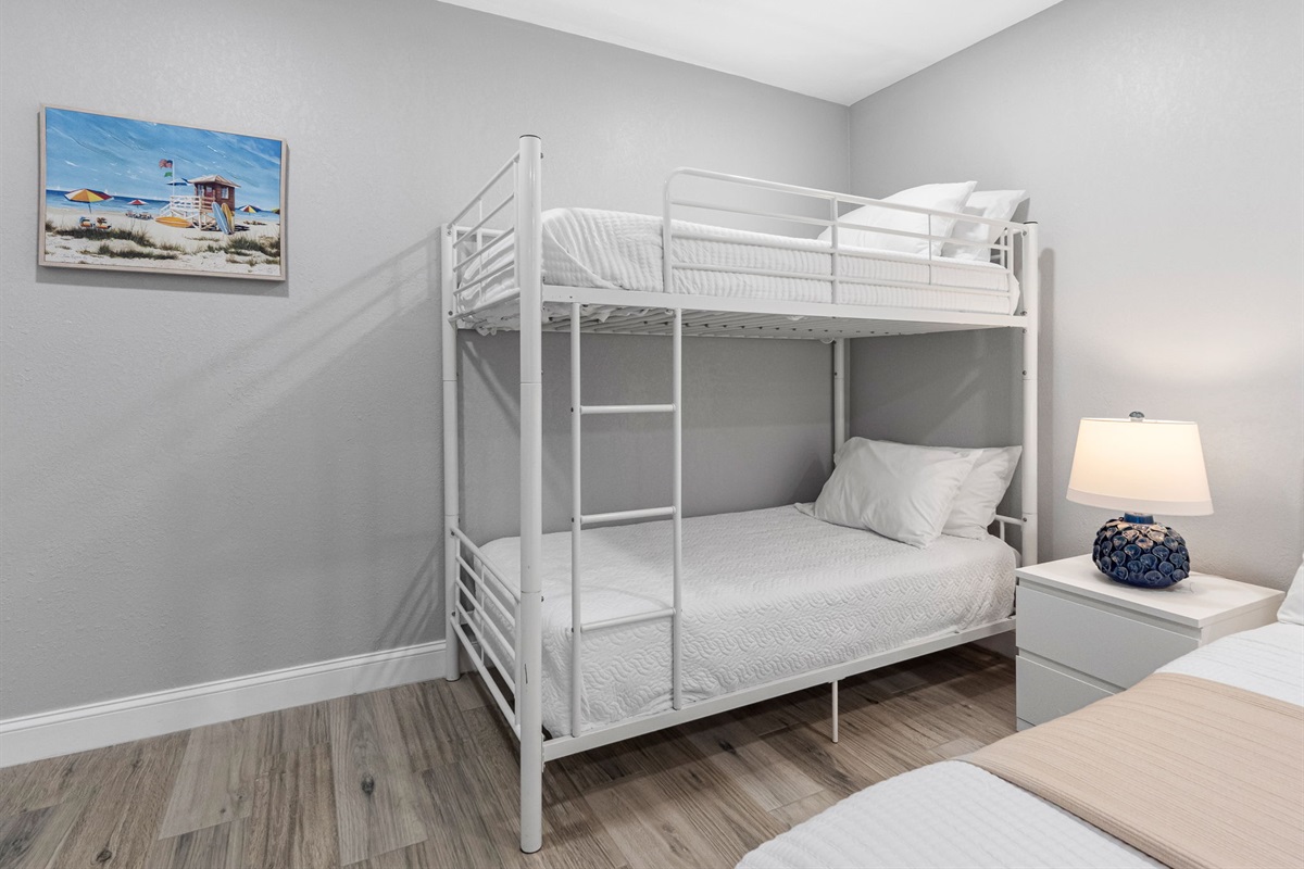 This thoughtfully designed room keeps the whole family close, offering both cozy king accommodations and fun bunk beds for the little ones