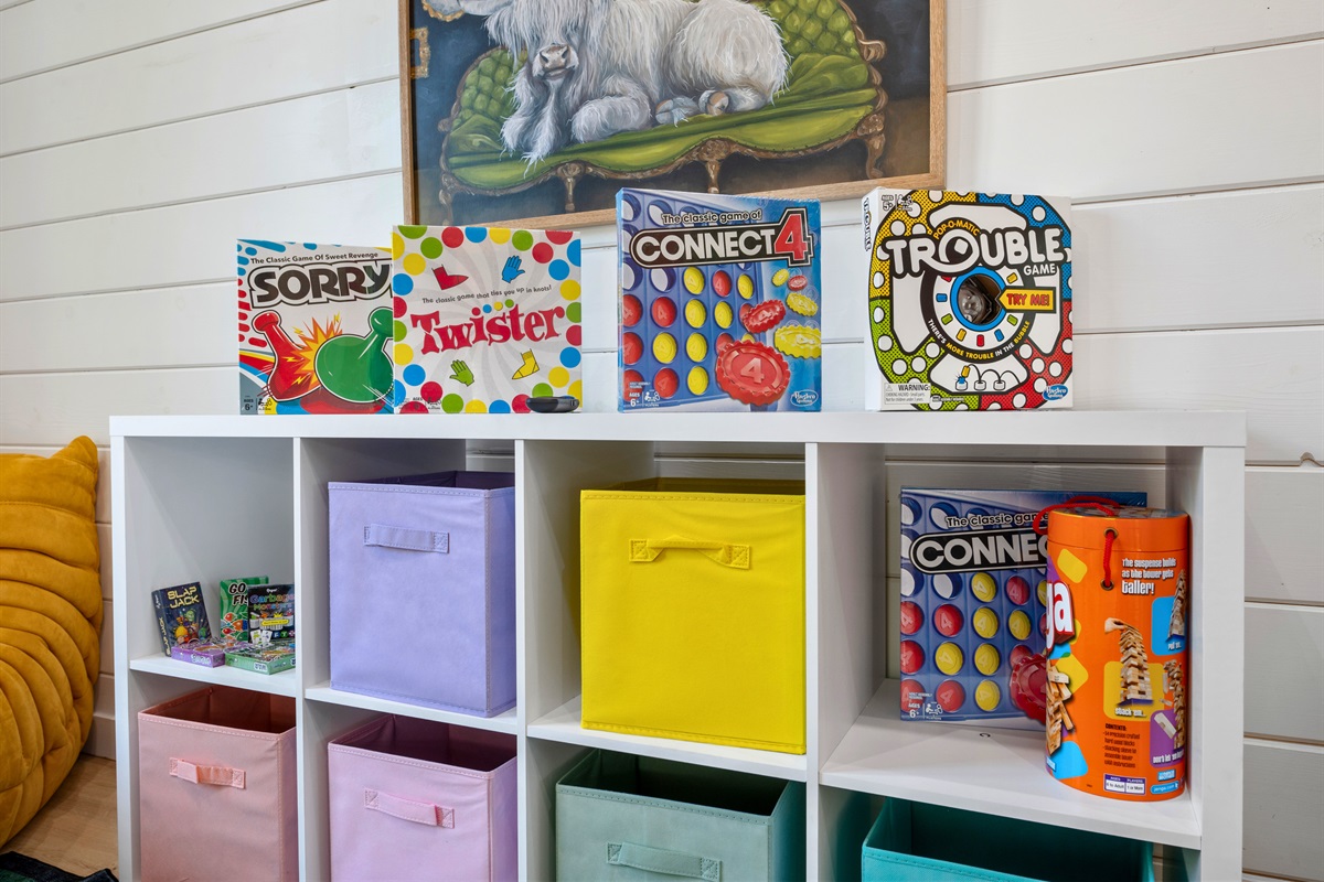 This playful corner is packed with classic board games and colorful storage, making it a dream space for kids.