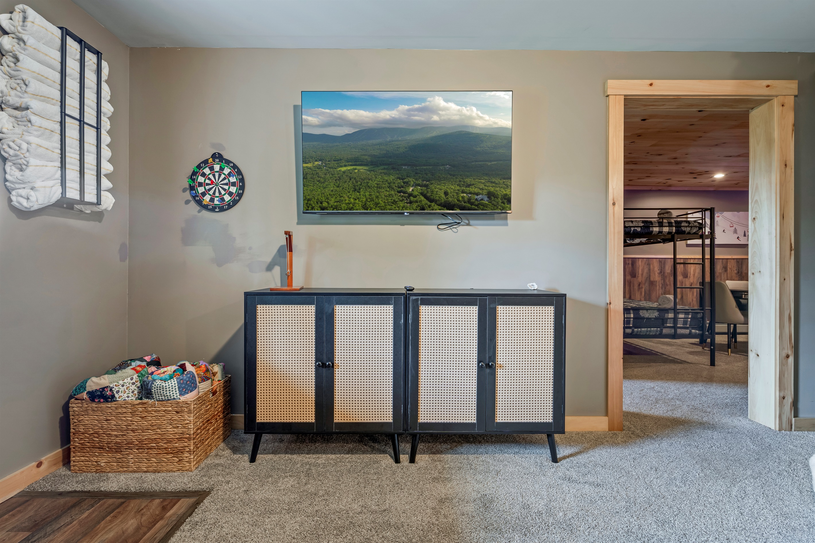 Enjoy an additional lounge area downstairs, complete with a cozy setup for movie nights.