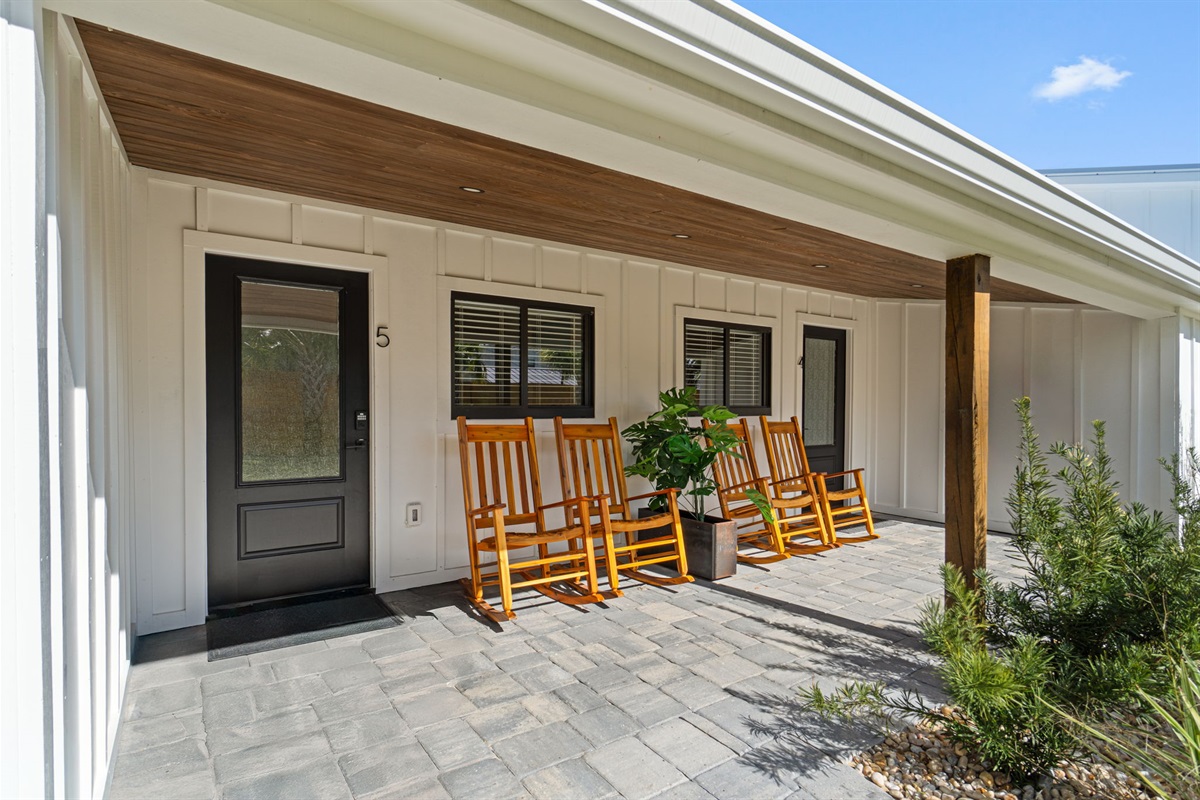 Small Serenity 5 has a covered front patio overlooking the fenced in yard - rock away with drink in hand watching the kids play!