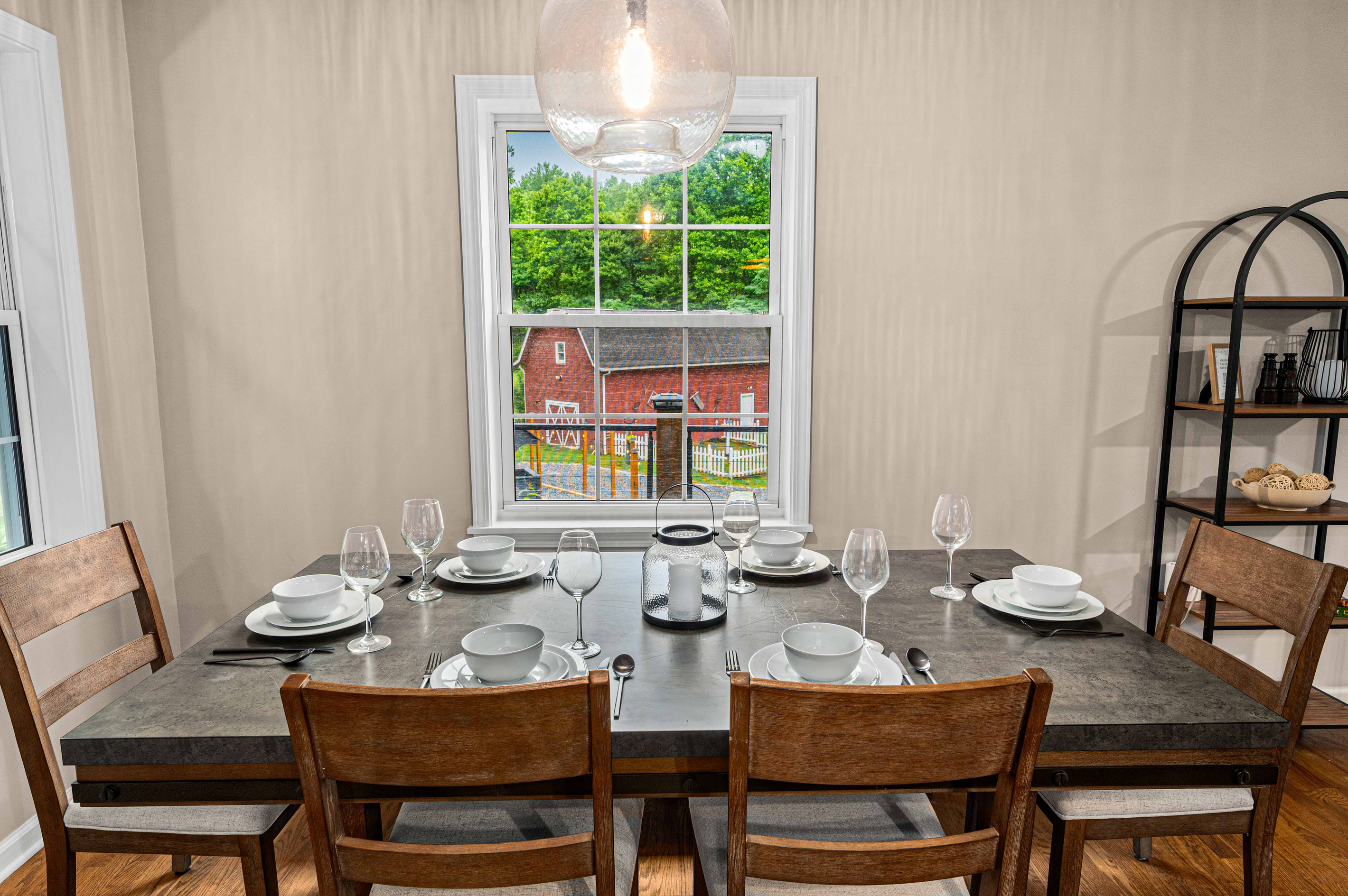 Dining Space: Gather around the stylish table and enjoy scenic views of the green hills!
