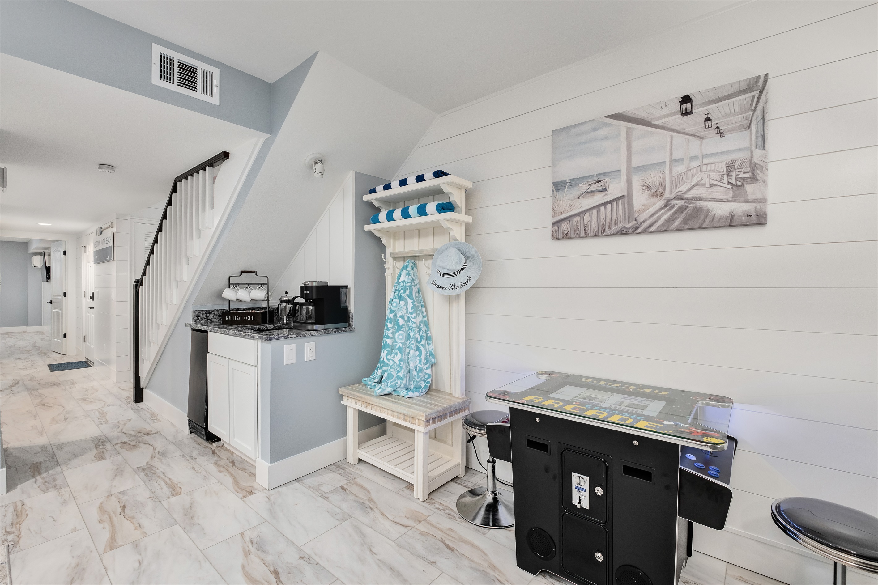 Need something for the kids to do? Have them play on the tabletop arcade nestled next to the luxurious living room while the parents enjoy a movie on the large screen TV.