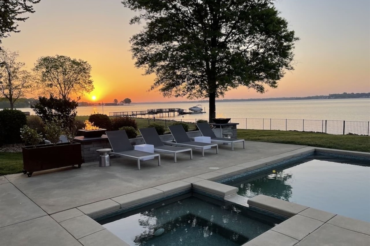 Amazing views from the pool at sunrise with firebowls lit up.