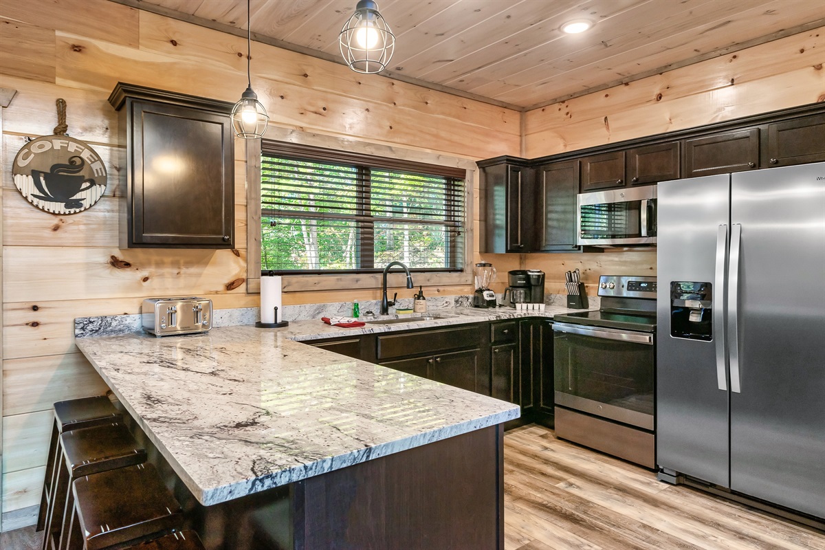 Spacious Kitchen With Bar Seating For Guests